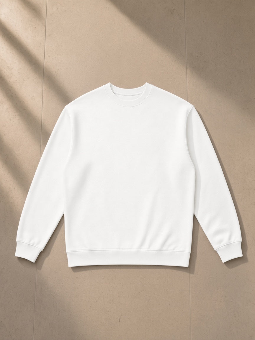 Oversized Crewneck Sweatshirt in White, laid flat on pale limestone, front view