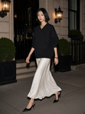 Two people à deux, the woman wearing the Oversized V-Neck Sweatshirt in Black