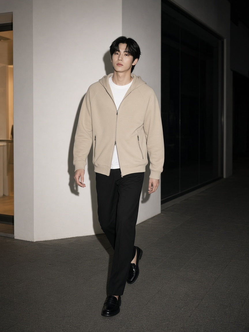 Man in the Marcel Afters Paneled Full Zip Hoodie in Beige walking a gallery street in Hannam-dong, Seoul at night