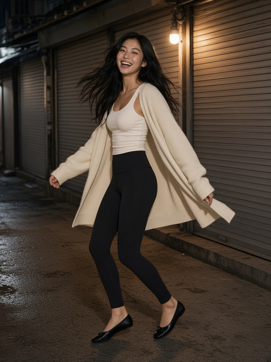 Woman in the High-Waisted Yoga Leggings in Black turning in a shuttered lane in Euljiro, Seoul at night