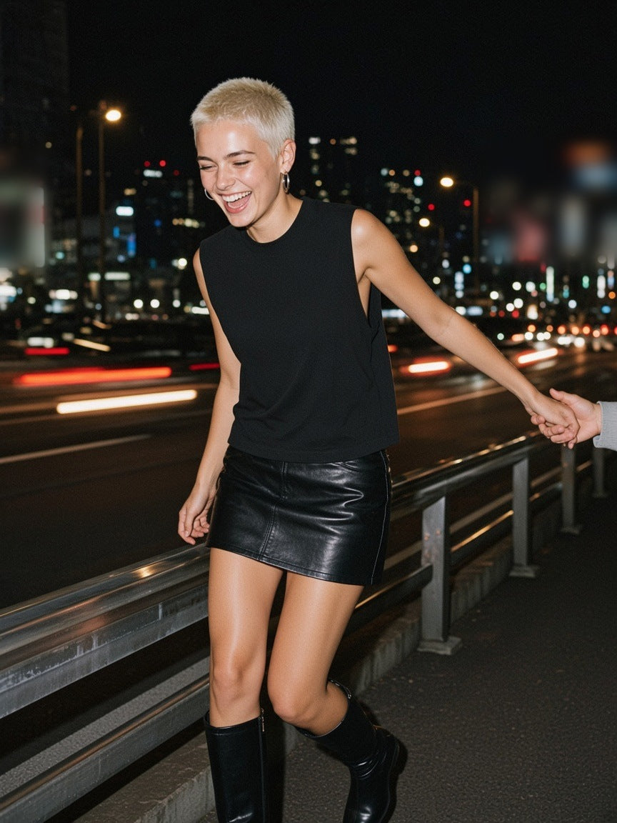 Two people in the Marcel Afters Raw Edge Cotton Tank Top in Black at a Tokyo hotel bar at night