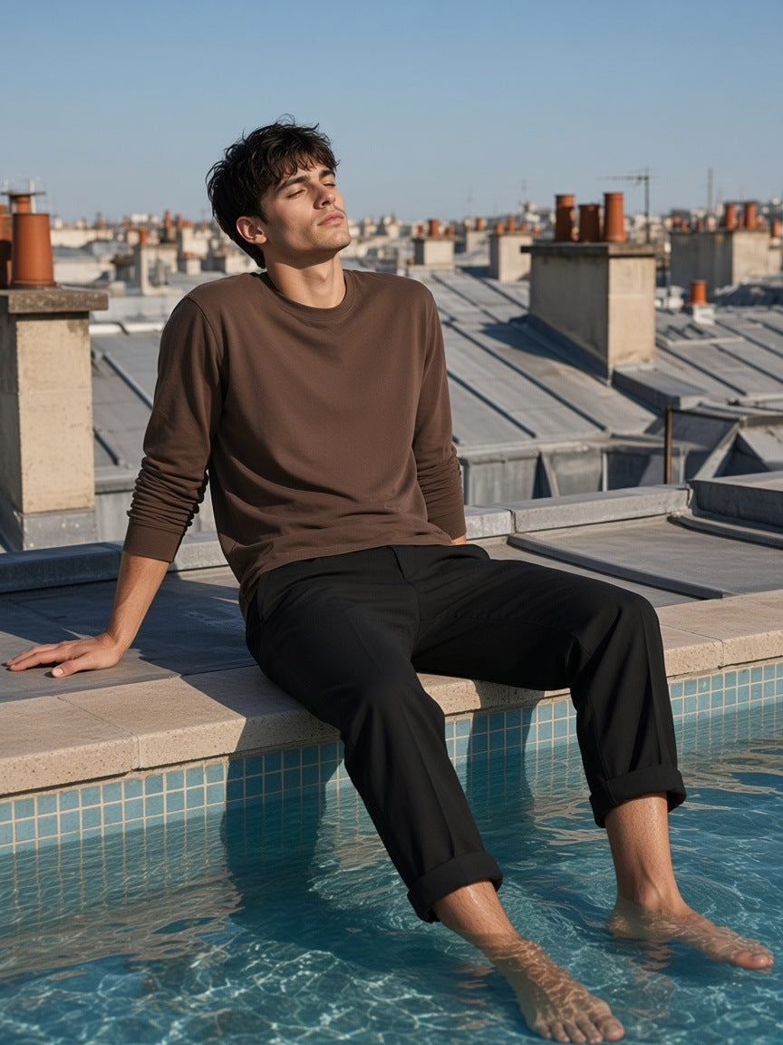 Man in the Raw Hem Long Sleeve T-Shirt in Coffee, at a rooftop hotel pool in the morning in Paris