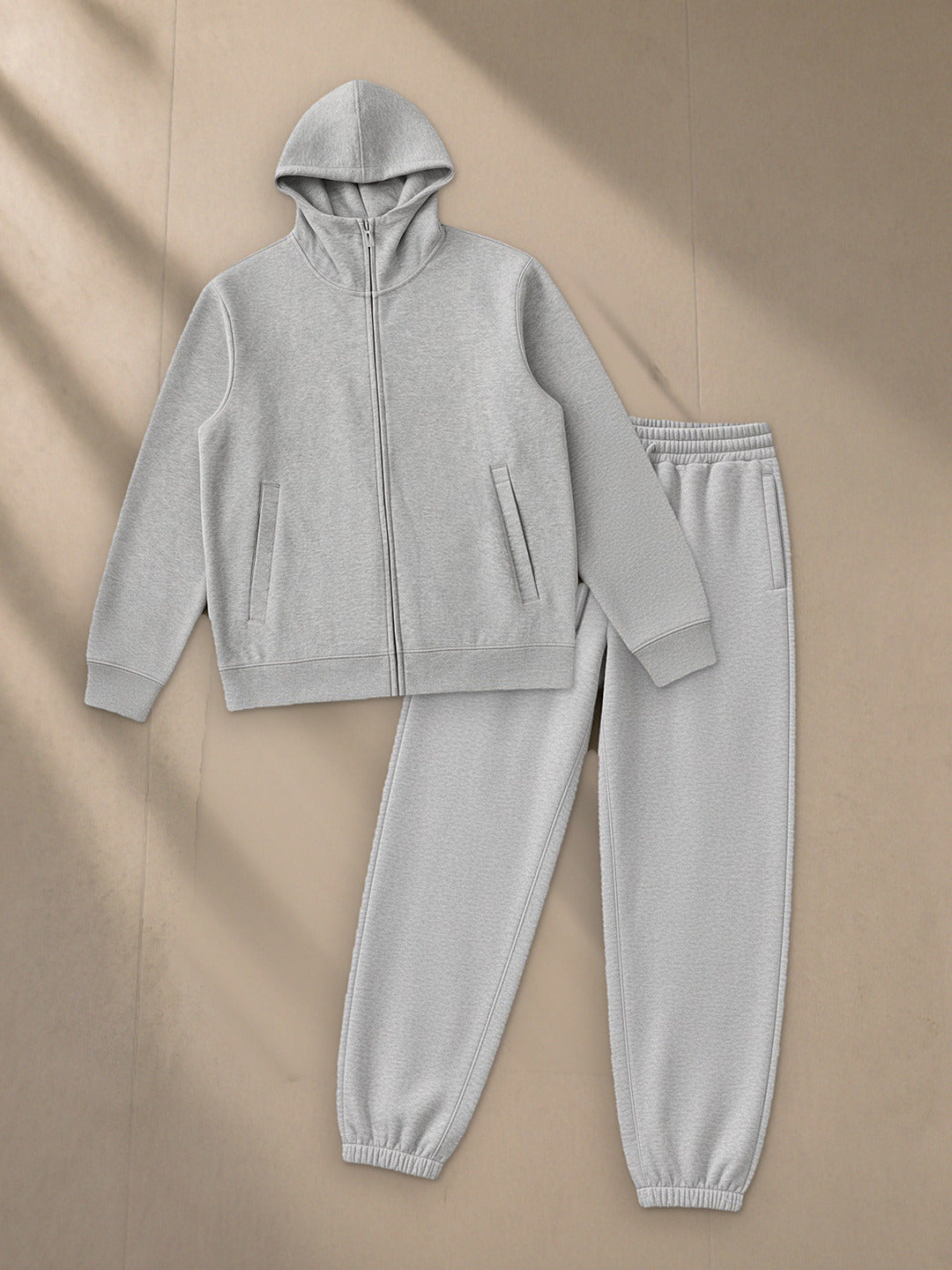 Men's Essential Heavyweight High Neck Zip-Up Hoodie + Heavyweight Fleece Joggers Set in Flower Gray, top and bottom laid flat together on pale limestone