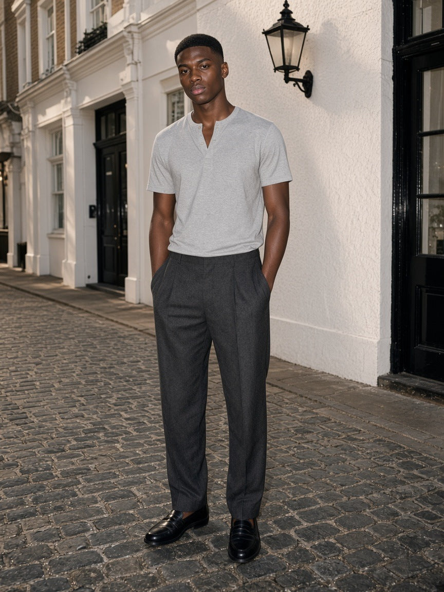 Man in the Short Sleeve Henley Shirt in Light Gray standing in a Mayfair mews in London in the morning