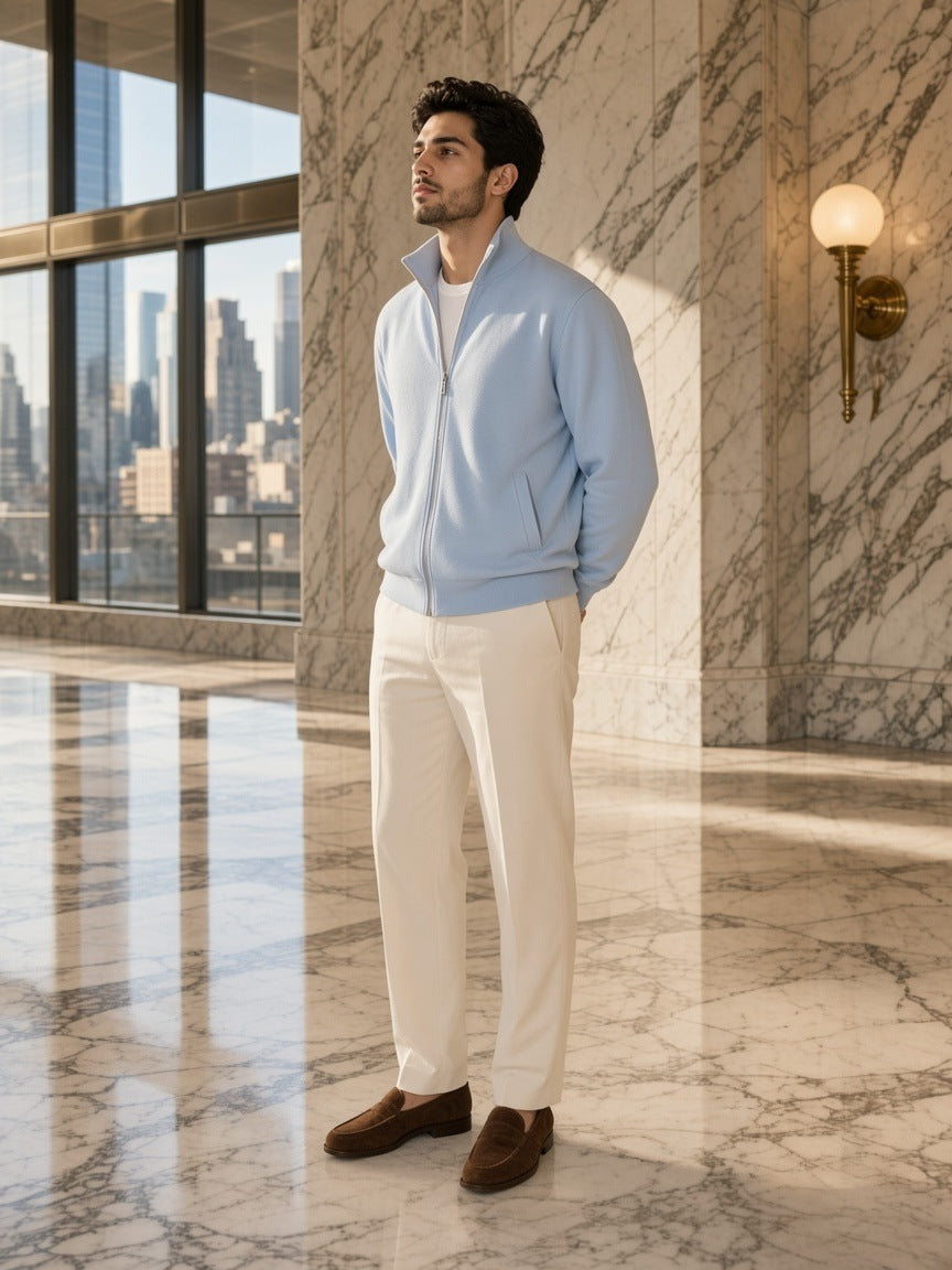 Man in the Stand Collar Jacket in Light Blue in a marble hotel lobby in New York by day