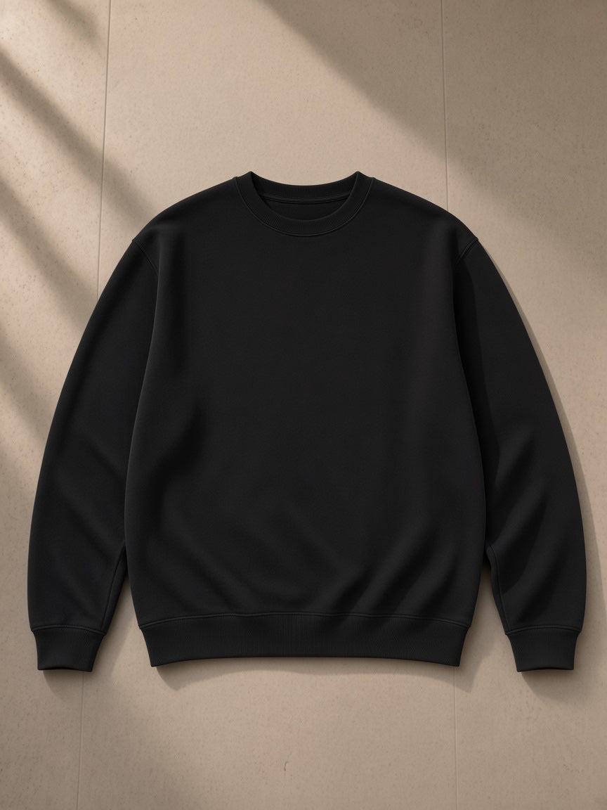 Streetwear Cotton Pullover in Pirate Black, laid flat on pale limestone, front view
