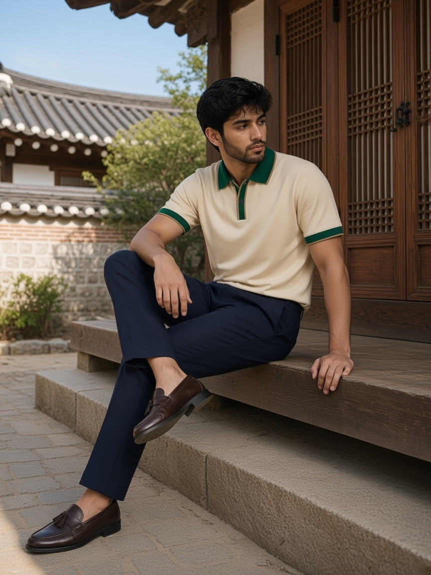 Man in the Color Block Polo Shirt in Apricot with Green in a hanok courtyard in Seoul in the morning