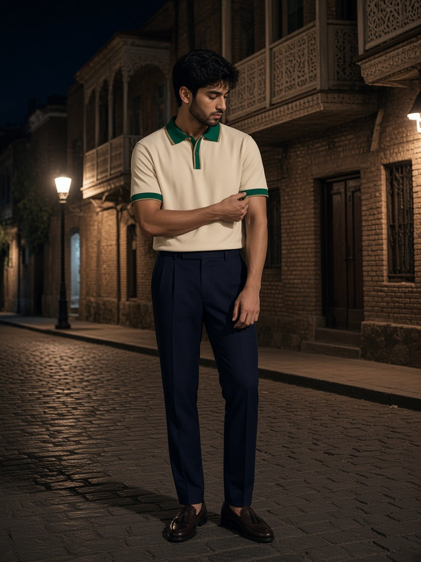Man in the Color Block Polo Shirt in Apricot with Green on an old-town street in Tbilisi at night