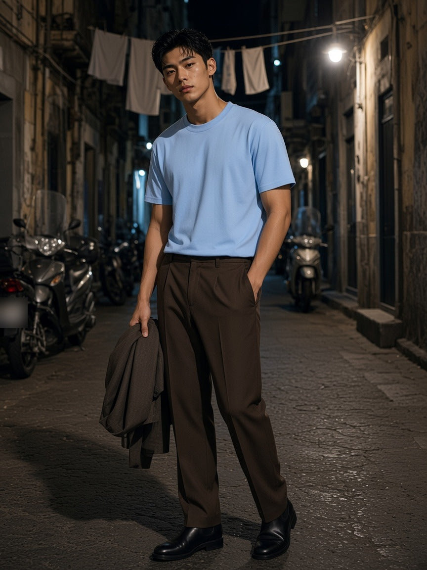 Man in the Drop Shoulder Cotton T-Shirt in Blue in a Quartieri Spagnoli alley in Naples at night
