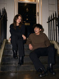 Two people in the Heavyweight Patch Pocket Crewneck Sweatshirt in Coffee and Black on London townhouse steps at night