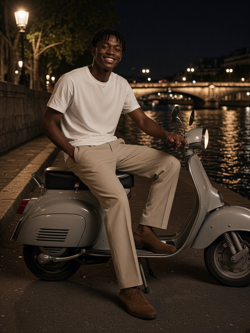Man in the Lightweight Crewneck T-Shirt in White on a scooter by the Seine in Paris at night
