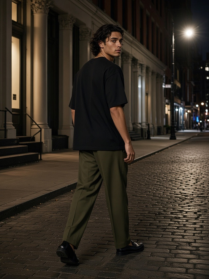 Man in the Oversized Cotton T-Shirt in Black walking Mercer Street in SoHo, New York at night