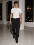 Two people à deux, the man wearing the Vintage Wash Sweatpants in Black