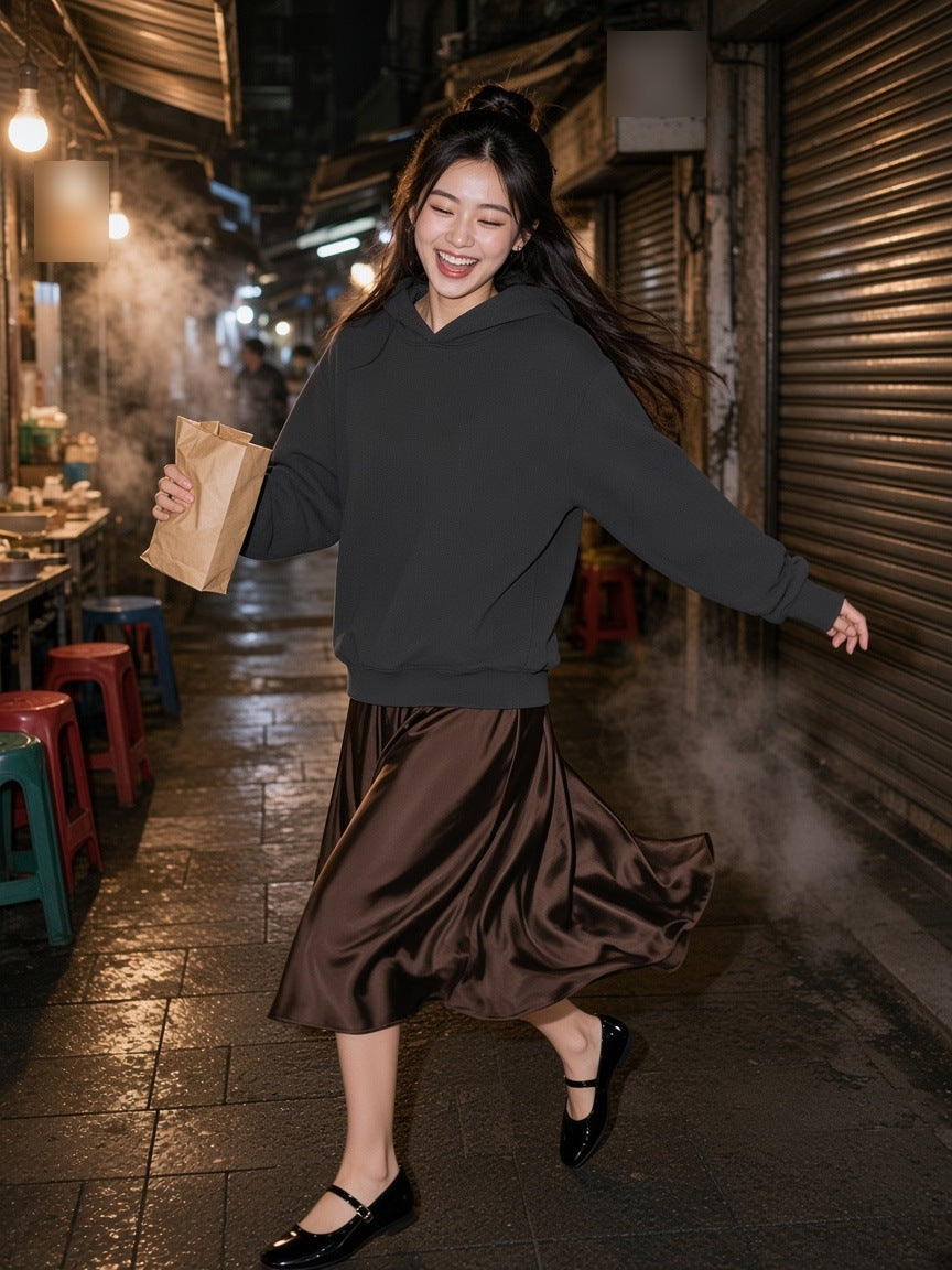 Woman in the Waffle Hoodie in Dark Gray with a chocolate satin skirt, spinning through a closing Taipei night market
