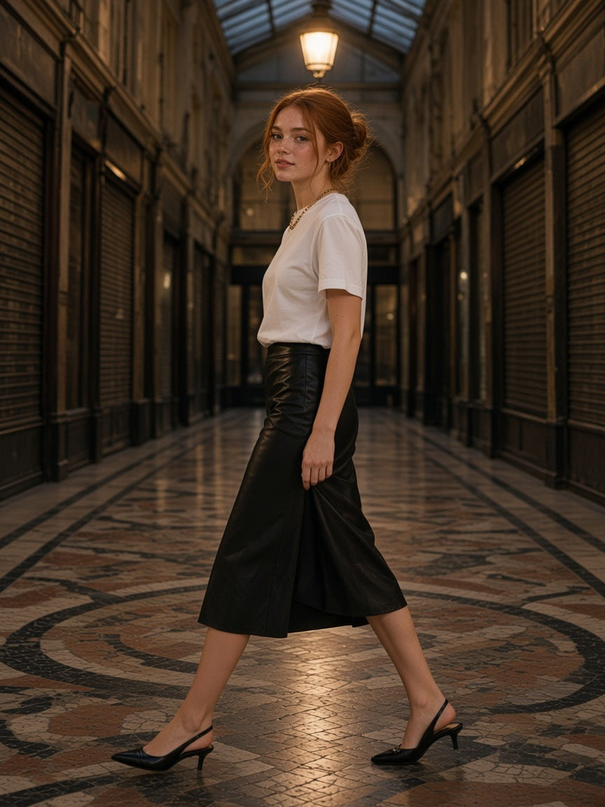 Woman in the Women's Essential Heavyweight Cotton T-Shirt in White walking through the Passage des Panoramas in Paris at night